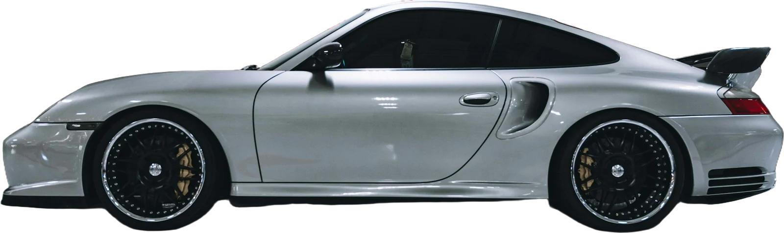 Silver two-door sports coupe, side view
